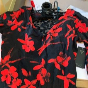 Ladies size small black with red flowers shirt
